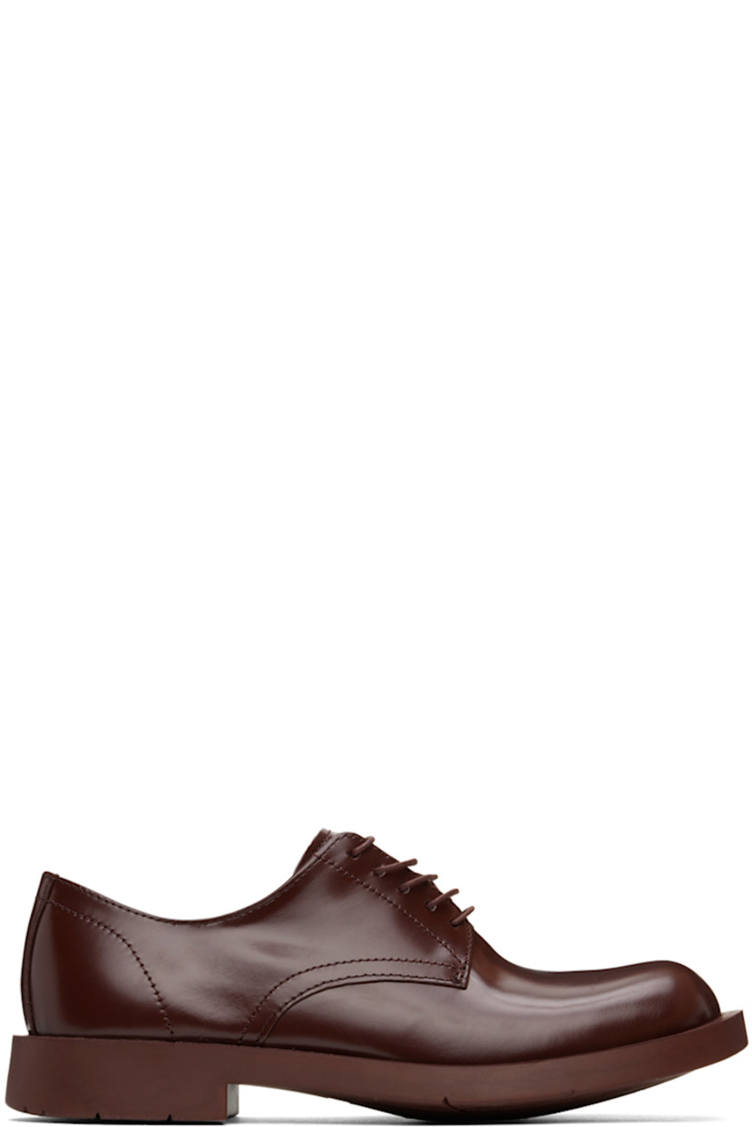 LWG-certified polished leather derbys in burgundy.

· Lace-up closure
· Cushioned OrthoLite® Recycled™ footbed
· Suede and buffed leather lining
· Treaded rubber sole

Supplier color: Burgundy