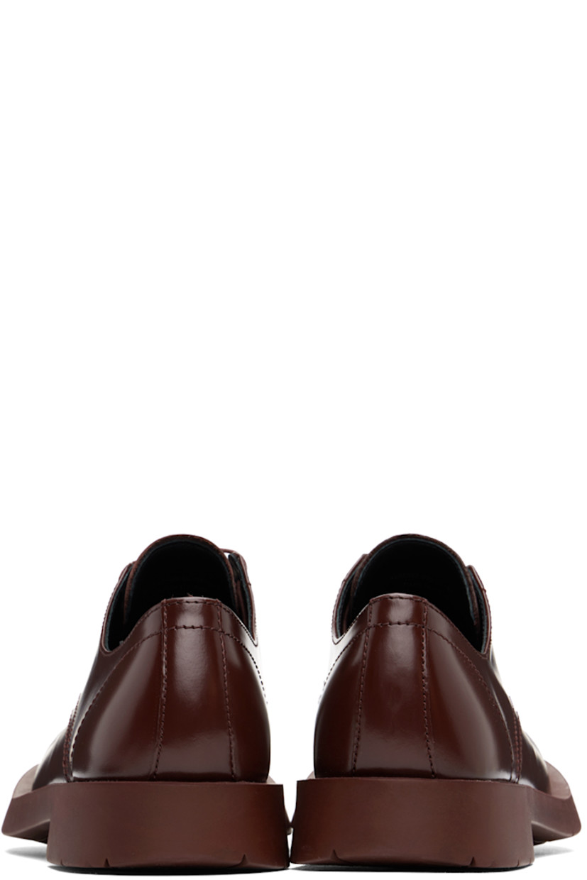 LWG-certified polished leather derbys in burgundy.

· Lace-up closure
· Cushioned OrthoLite® Recycled™ footbed
· Suede and buffed leather lining
· Treaded rubber sole

Supplier color: Burgundy