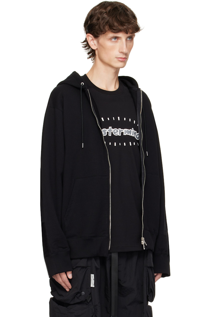 Anti-odor French terry hoodie. Patches and raw edges throughout. 

· Paneled construction 
· Drawstring at hood
· Two-way zip closure
· Patch pockets
· Logo flags at hem
· Rib-knit hem and cuffs 
· Logo printed at sleeve and back
· Embroidered logo and zip expansion panel at cuffs
· Welt pockets at back
· Detachable logo-printed trim at interior
· Logo-engraved silver-tone hardware

Supplier color: Black