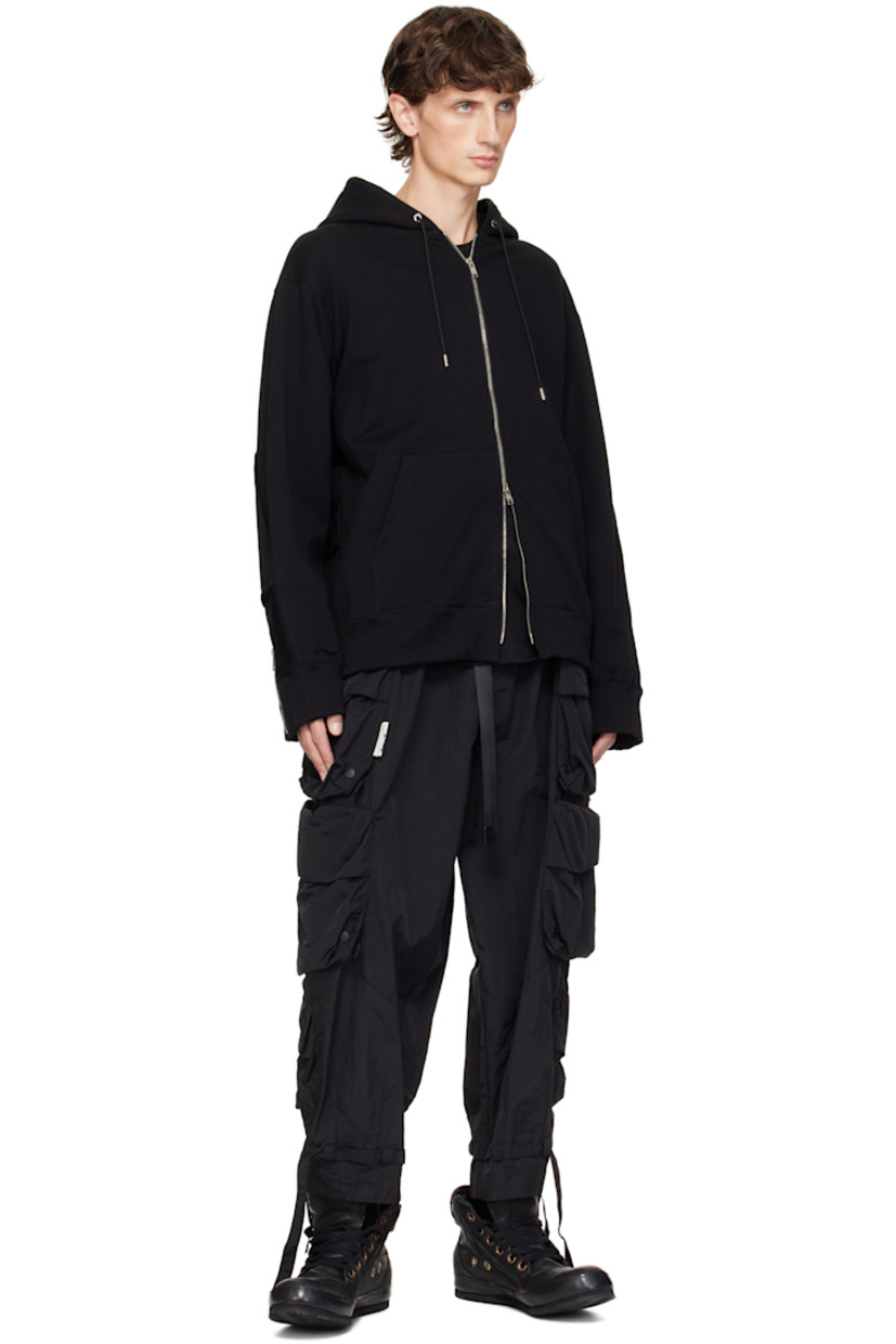 Anti-odor French terry hoodie. Patches and raw edges throughout. 

· Paneled construction 
· Drawstring at hood
· Two-way zip closure
· Patch pockets
· Logo flags at hem
· Rib-knit hem and cuffs 
· Logo printed at sleeve and back
· Embroidered logo and zip expansion panel at cuffs
· Welt pockets at back
· Detachable logo-printed trim at interior
· Logo-engraved silver-tone hardware

Supplier color: Black
