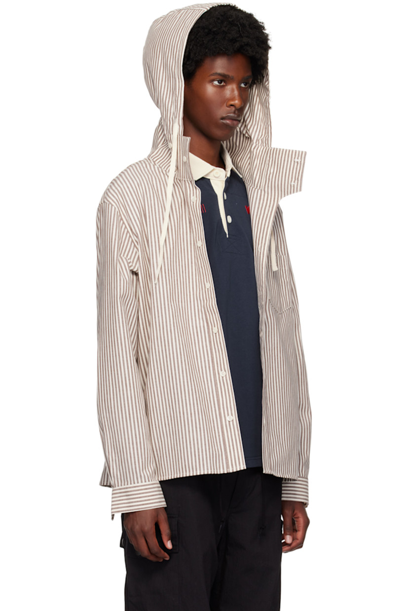 Cotton broadcloth shirt. Stripes throughout.

· Drawstring at hood
· Stand collar
· Button closure
· Logo patch at patch pocket
· Single-button barrel cuffs

Supplier color: Brown stripe