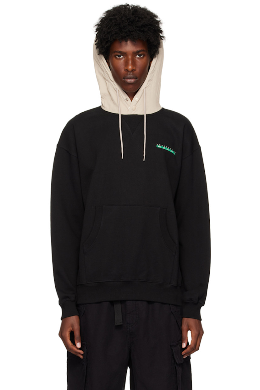 French terry hoodie.

· Drawstring and press-stud fastening at taffeta hood
· Logo embroidered at chest
· Kangaroo pocket
· Rib knit hem and cuffs
· Dropped shoulders

Supplier color: Black/Beige