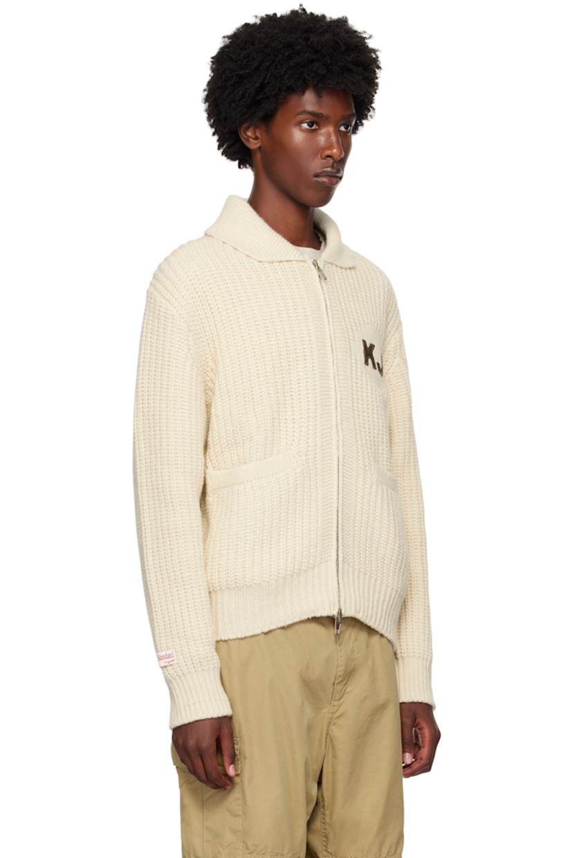 Rib knit wool- and nylon-blend cardigan.

· Shawl collar
· Two-way zip closure
· Logo embroidered at chest
· Welt pockets
· Logo patch at cuff
· Text and logo patch at back 
· Silver-tone hardware

Supplier color: Ivory