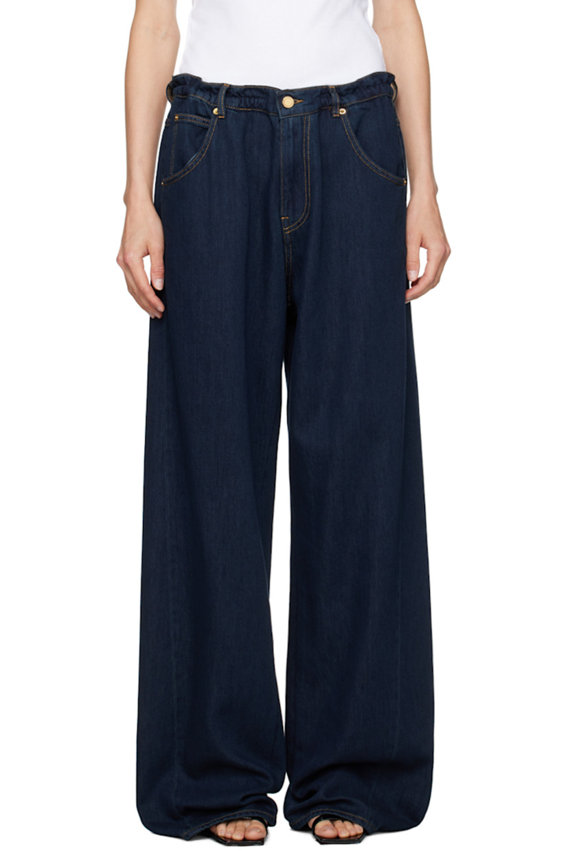 Baggy-fit wide-leg non-stretch denim jeans. 

· Mid-rise
· Belt loops
· Drawstring at waistband
· Five-pocket styling
· Zip-fly
· Dropped inseam
· Twisted outseams
· Leather logo patch at back waistband
· Gold-tone hardware
· Contrast stitching in tan

Supplier color: Deep Blue