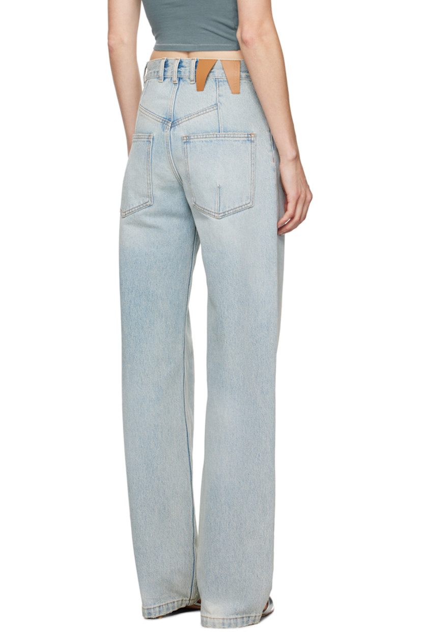 Straight-leg non-stretch denim jeans. Fading, subtle distressing, and darts throughout.

· High-rise
· Belt loops
· Five-pocket styling
· Zip-fly
· Leather logo patch at back waistband
· Logo-engraved gold-tone hardware
· Contrast stitching in tan

Supplier color: Lil light