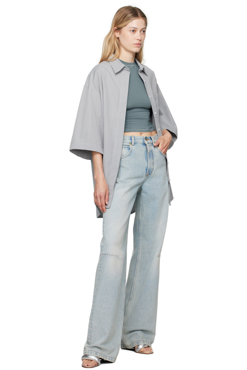 Straight-leg non-stretch denim jeans. Fading, subtle distressing, and darts throughout.

· High-rise
· Belt loops
· Five-pocket styling
· Zip-fly
· Leather logo patch at back waistband
· Logo-engraved gold-tone hardware
· Contrast stitching in tan

Supplier color: Lil light