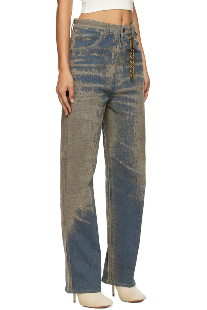 Stretch denim jeans. Jacquard pattern throughout. 

· Belt loops
· Carabiner with chain at belt loop 
· Four-pocket styling
· Zip-fly
· Patch pocket at outseam
· Hammer loop at outseam
· Leather logo patch at back waistband
· Logo-engraved brass-tone hardware
· Contrast stitching in tan

Supplier color: Faded sand wash