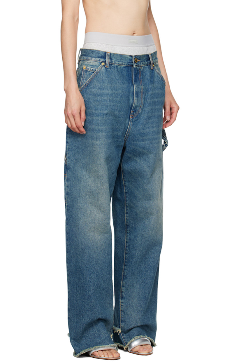 Loose-fit wide-leg non-stretch denim jeans. Fading and whiskering throughout.

· Belt loops
· Five-pocket styling
· Zip-fly
· Raw edge and rip at cuffs
· Dropped inseam
· Patch pocket at outseam
· Hammer loop at outseam
· Leather logo patch at back waistband
· Logo-engraved gold-tone hardware
· Contrast stitching in tan

Supplier color: Medium wash