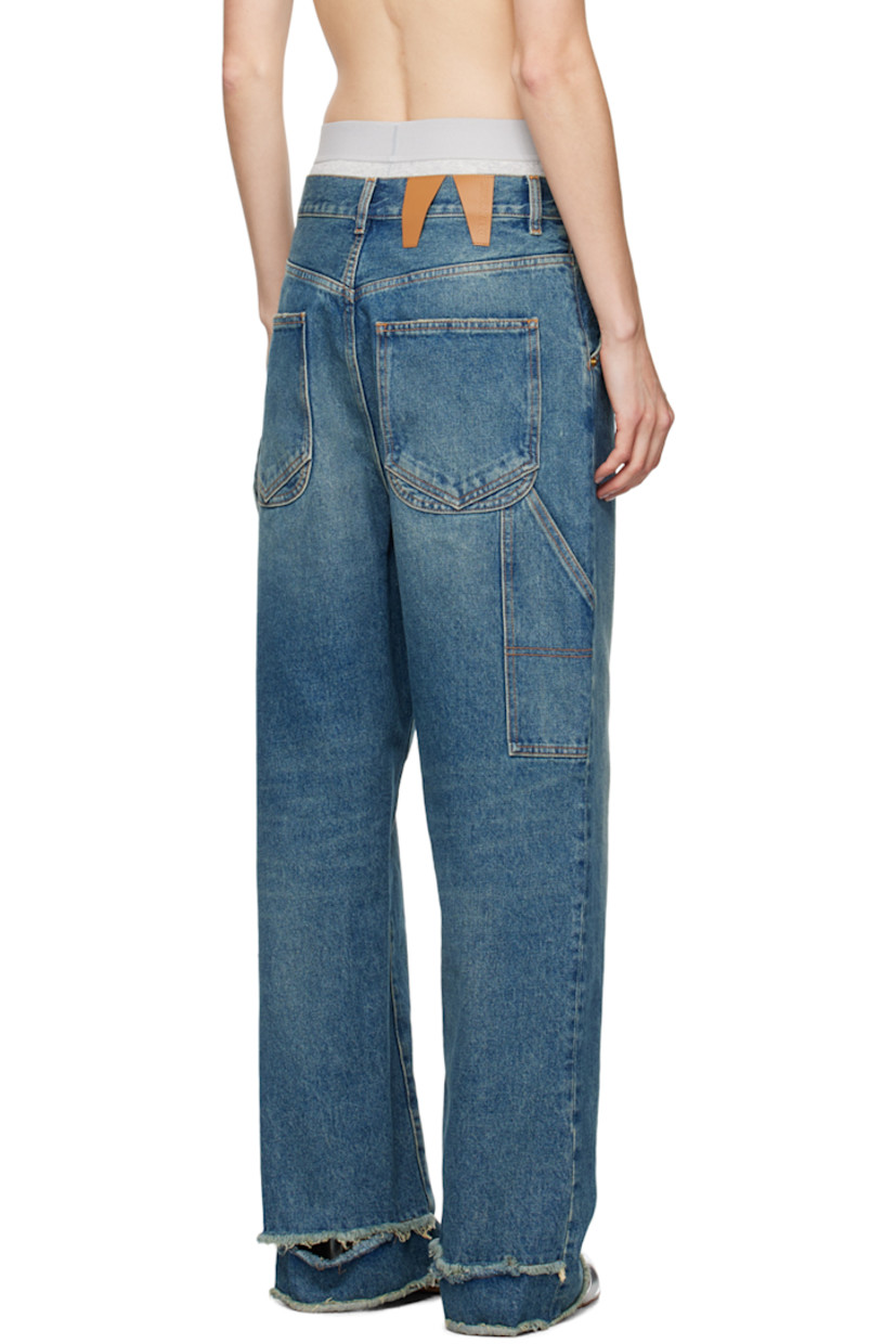 Loose-fit wide-leg non-stretch denim jeans. Fading and whiskering throughout.

· Belt loops
· Five-pocket styling
· Zip-fly
· Raw edge and rip at cuffs
· Dropped inseam
· Patch pocket at outseam
· Hammer loop at outseam
· Leather logo patch at back waistband
· Logo-engraved gold-tone hardware
· Contrast stitching in tan

Supplier color: Medium wash