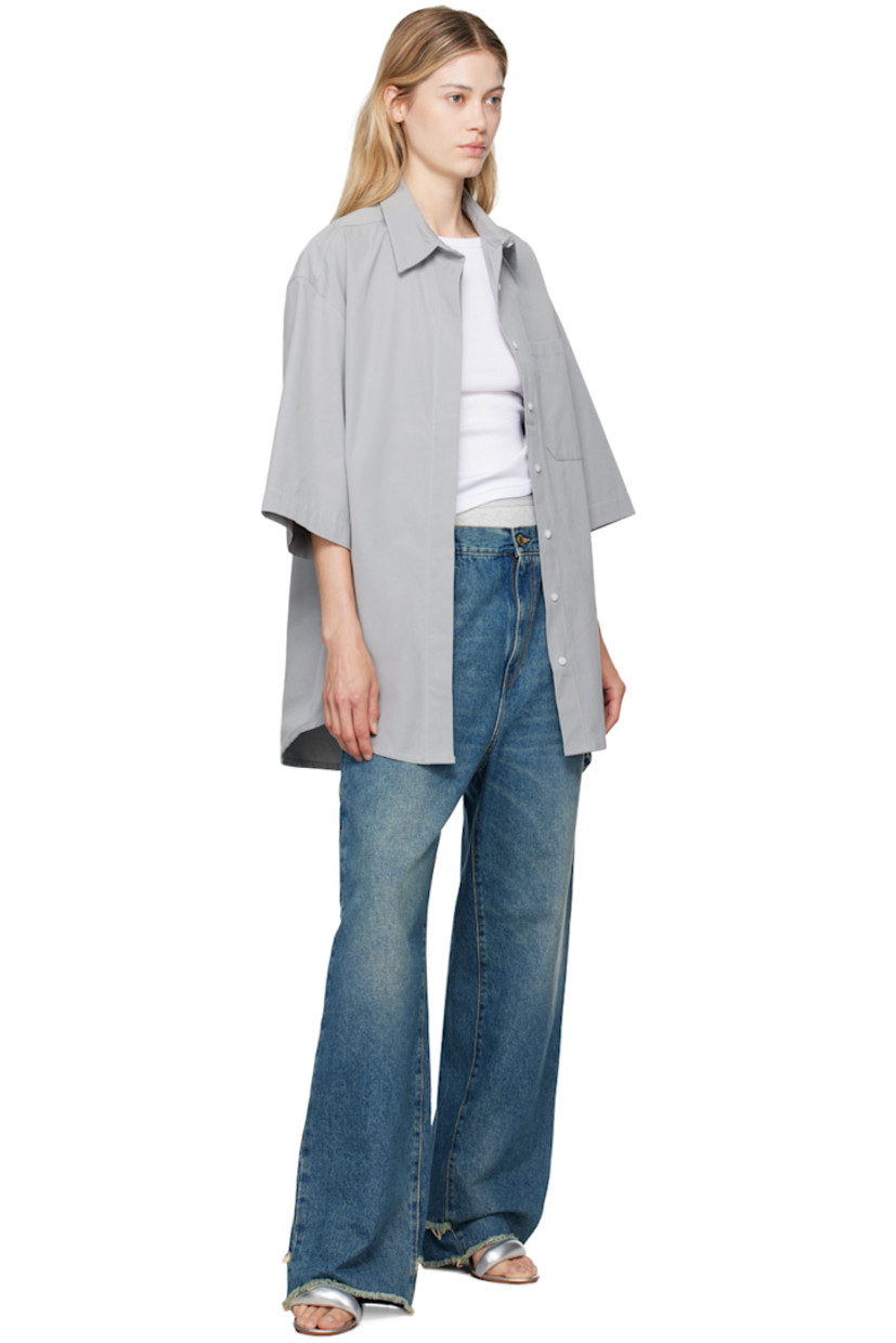 Loose-fit wide-leg non-stretch denim jeans. Fading and whiskering throughout.

· Belt loops
· Five-pocket styling
· Zip-fly
· Raw edge and rip at cuffs
· Dropped inseam
· Patch pocket at outseam
· Hammer loop at outseam
· Leather logo patch at back waistband
· Logo-engraved gold-tone hardware
· Contrast stitching in tan

Supplier color: Medium wash