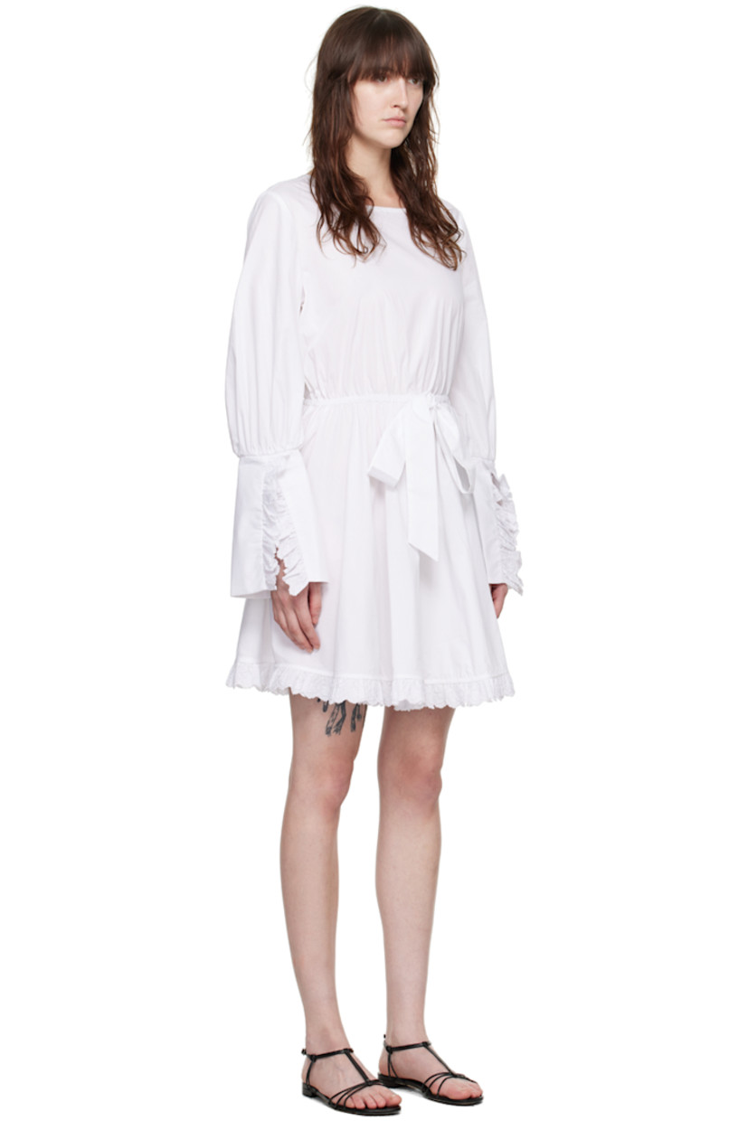 Cotton poplin dress. Ruffled trim with embroidered floral detailing at hem and vented cuffs.

· Square neck
· Self-tie strap with bow accent at elasticized waistband
· Gathering at sleeves
· Button fastening at back collar

Supplier color: White