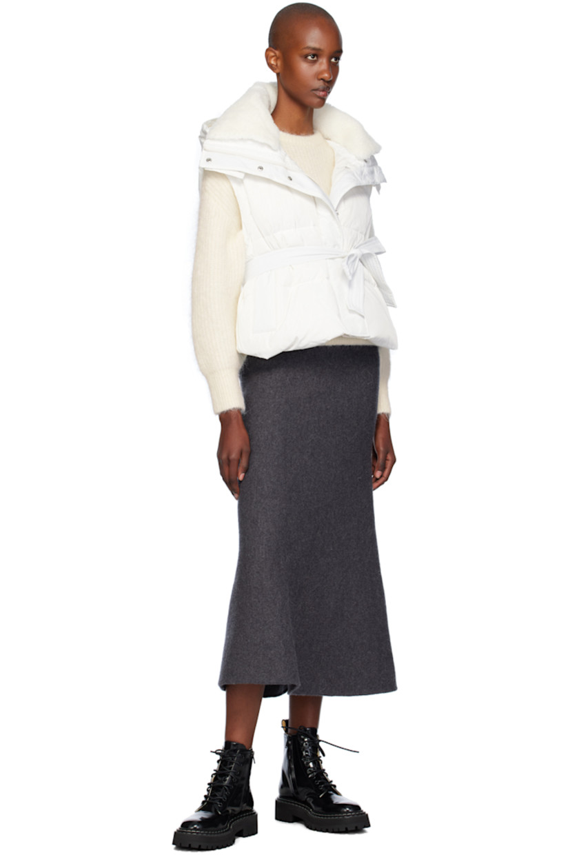 Down-filled and quilted polyester taffeta vest.

· Press-stud throat guard at detachable hood
· Shearling trim at funnel neck
· Zip closure with press-stud placket
· Welt pockets
· Detachable self-tie belt
· Full satin lining

Supplier color: Cime

Fill: 90% duck down, 10% duck feather.