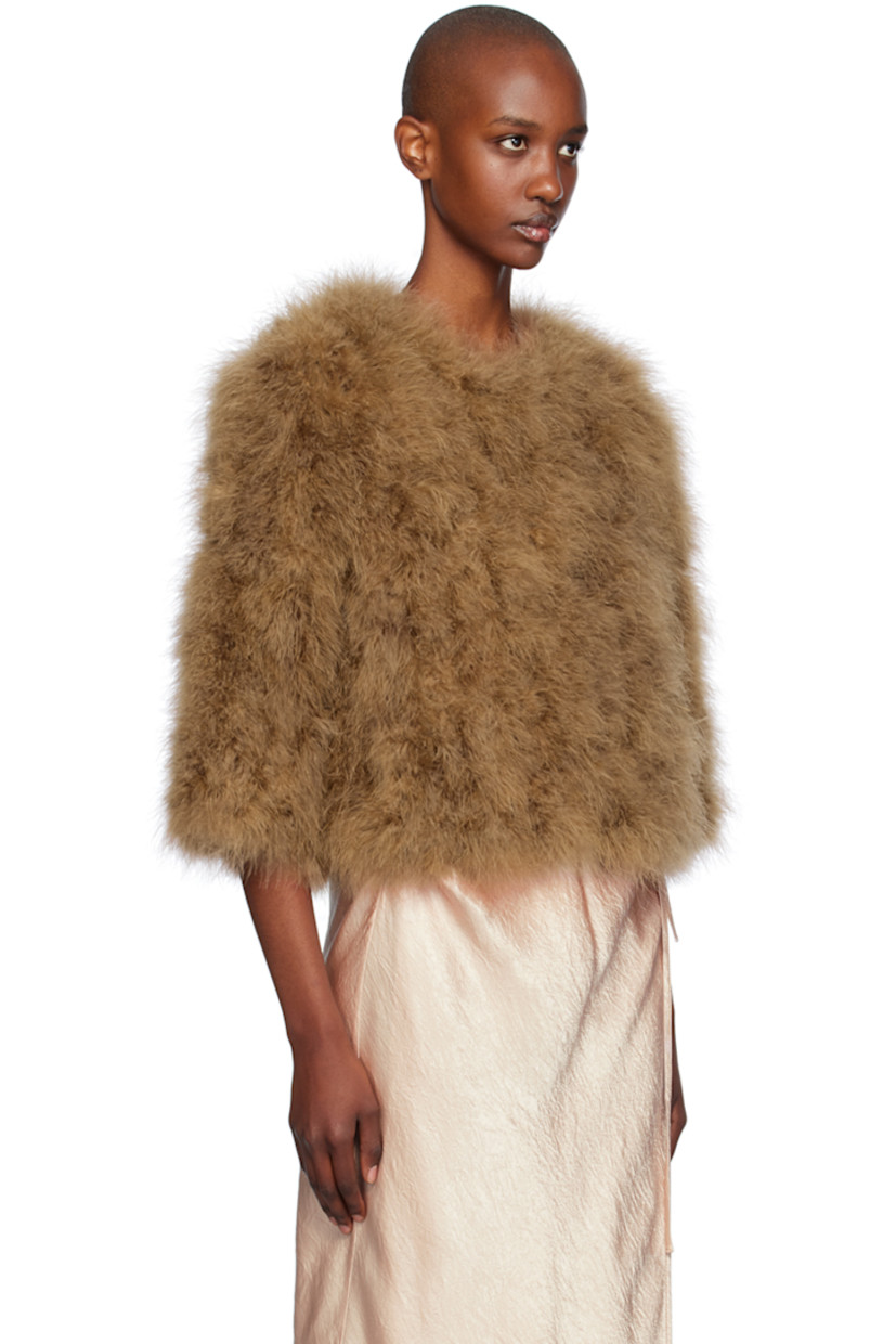 Turkey feather jacket.

· Round neck
· Hook-eye closure
· Cropped hem
· Seam pockets
· Full silk satin lining

Supplier color: Madeleine

Body: 100% turkey feather.