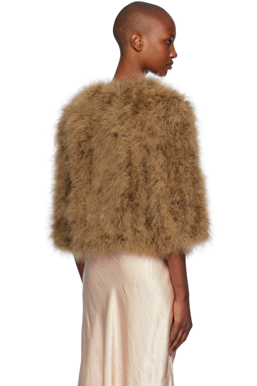 Turkey feather jacket.

· Round neck
· Hook-eye closure
· Cropped hem
· Seam pockets
· Full silk satin lining

Supplier color: Madeleine

Body: 100% turkey feather.