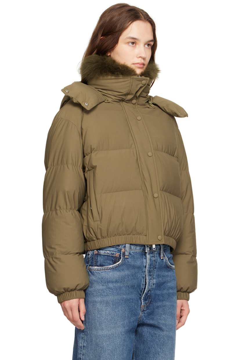 Down-filled quilted stretch nylon jersey jacket. Water-repellent.

· Detachable hood with throat guard
· Detachable lamb fur trim at funnel neck
· Two-way zip closure with press-stud placket
· Zip pockets
· Elasticized cropped hem and cuffs
· Logo-engraved silver-tone hardware 

Supplier color: Thym

Fill: 95% duck down, 5% duck feather.