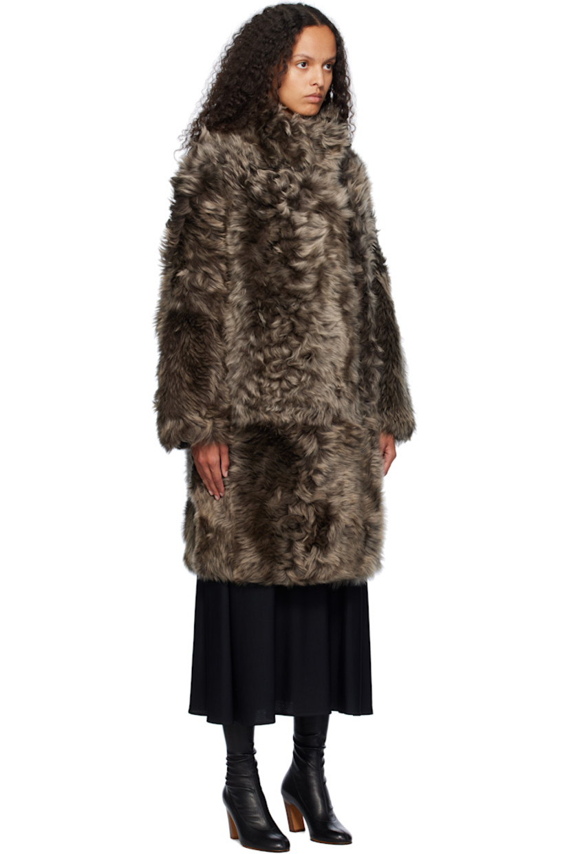 Reversible shearling jacket. 

Reverse in brown grained lambskin.

· Stand collar
· Press-stud closure
· Welt pockets

Supplier color: Alpes