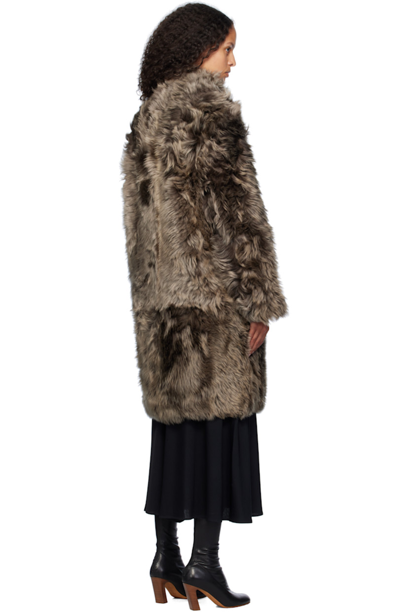 Reversible shearling jacket. 

Reverse in brown grained lambskin.

· Stand collar
· Press-stud closure
· Welt pockets

Supplier color: Alpes