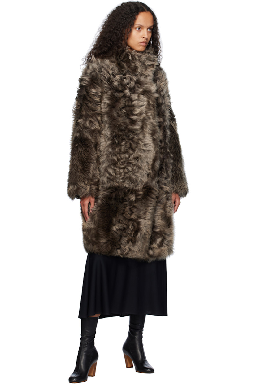 Reversible shearling jacket. 

Reverse in brown grained lambskin.

· Stand collar
· Press-stud closure
· Welt pockets

Supplier color: Alpes