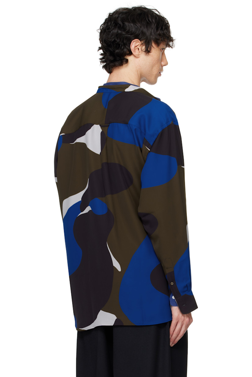 Polyester twill shirt. Graphic pattern printed throughout.

· Band collar
· Self-tie closure
· Shirttail hem
· Logo patch at side seams
· Single-button barrel cuffs
· Locker loop and box pleat at back yoke

Supplier color: Pattern