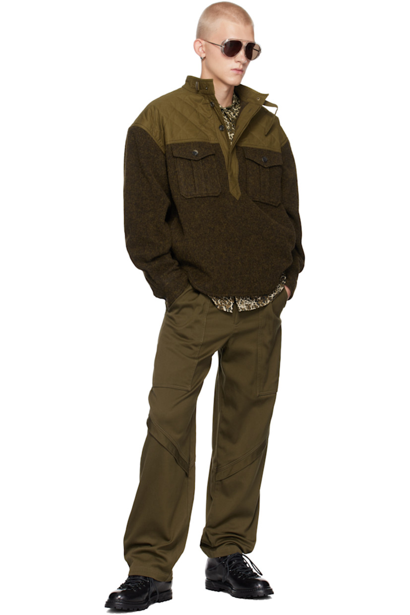 Recycled wool-blend flannel shirt.

· Paneled construction
· Band collar
· Concealed three-button placket
· Flap pockets
· Shirttail hem
· Flap and seam pockets
· Quilted cotton canvas panel at shoulders
· Dropped shoulders
· Pleating at single-button barrel cuffs
· Logo-engraved hardware

Supplier color: Dark khaki