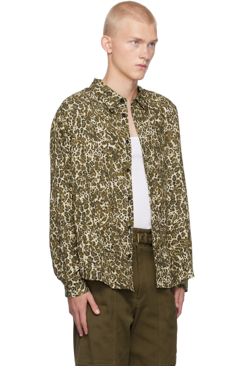 Tencel twill shirt. Printed leopard pattern throughout.

· Spread collar
· Button closure
· Droptail hem
· Single-button barrel cuffs
· Box pleat at back yoke
· Logo-engraved black-tone hardware

Supplier color: Leopard