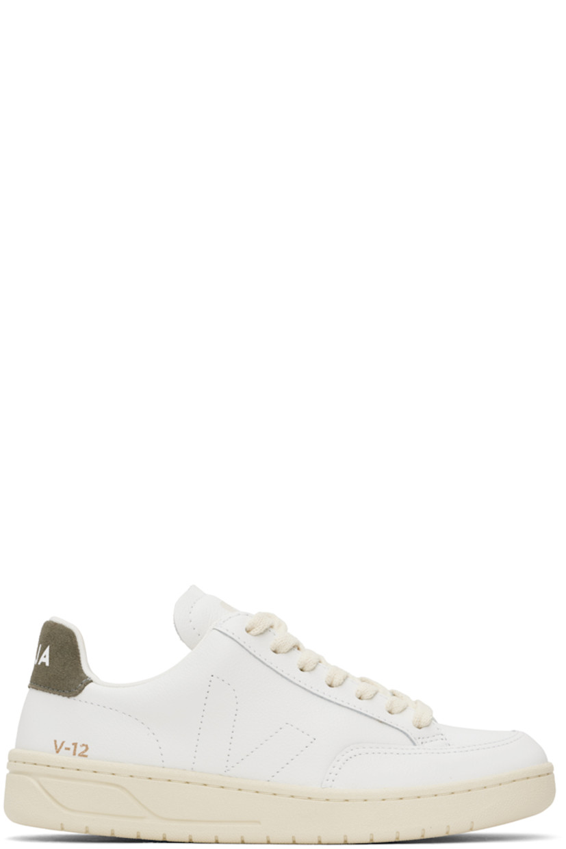 Low-top Organic Traced grained leather sneakers in white and khaki.

· Lace-up closure
· Logo printed at padded tongue
· Padded collar
· Logo stitched at sides
· Logo stamp at outer side
· Logo printed at suede heel tab
· Recycled polyester jersey lining
· Treaded rubber sole

Supplier color: Extra white/Khaki
