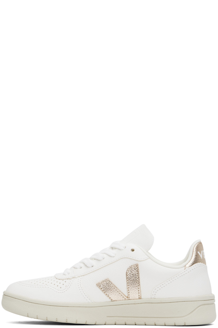 Low-top grained ChromeFree leather sneakers in white and rose gold tone.

· Perforated detailing at toe
· Lace-up closure
· Logo embossed at tongue
· Padded collar
· Logo appliqué at sides 
· Logo printed at heel tab
· Mesh lining
· Treaded rubber sole

Supplier color: Extra white/Platine