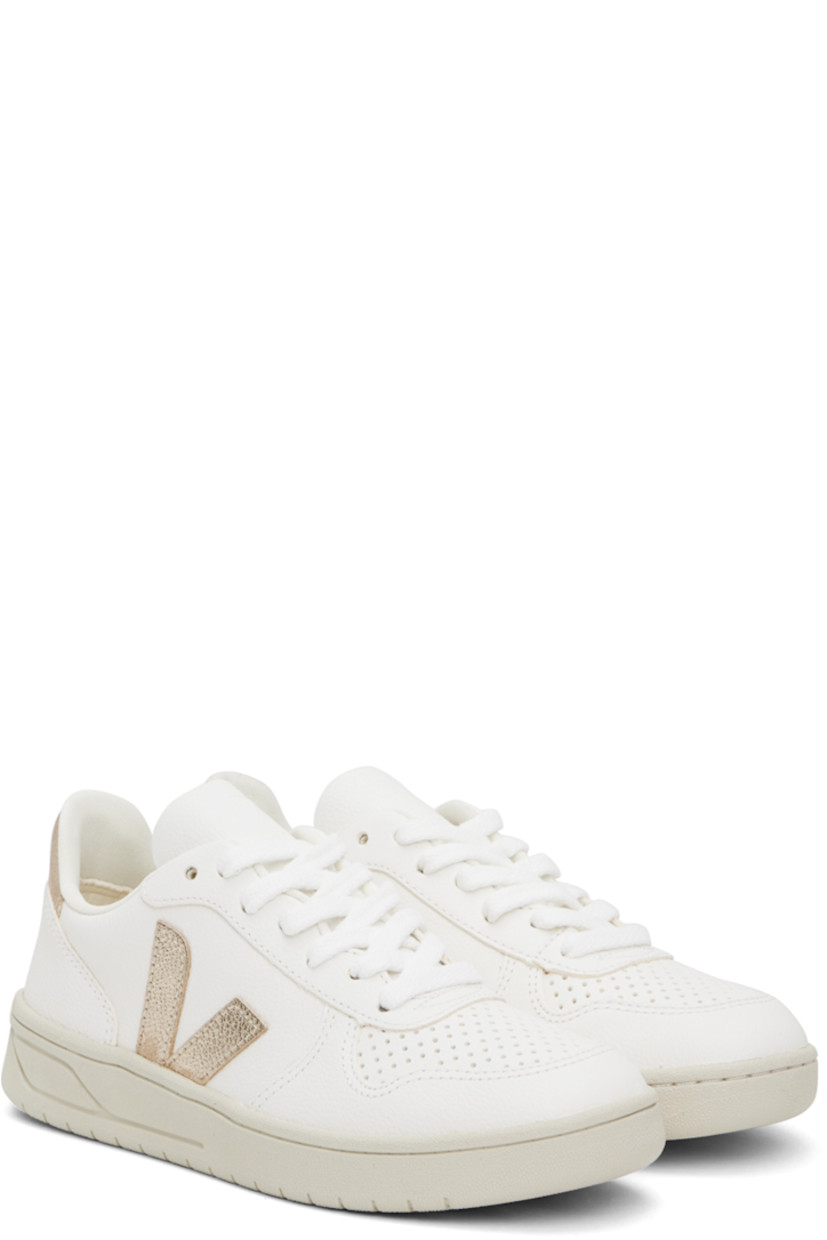 Low-top grained ChromeFree leather sneakers in white and rose gold tone.

· Perforated detailing at toe
· Lace-up closure
· Logo embossed at tongue
· Padded collar
· Logo appliqué at sides 
· Logo printed at heel tab
· Mesh lining
· Treaded rubber sole

Supplier color: Extra white/Platine