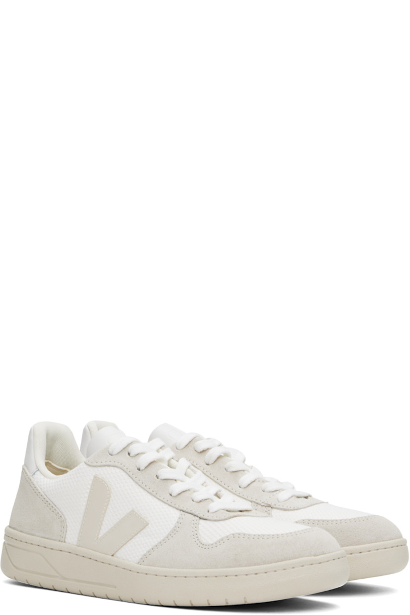 Low-top recycled plastic B-Mesh, suede, and leather sneakers in white.

· Lightweight, breathable, and water-repellent
· Lace-up closure
· Logo embossed at tongue
· Padded collar
· Rubber logo appliqué at sides
· Logo printed at heel tab
· Recycled polyester jersey lining
· Treaded rubber sole 

Supplier color: White natural/Pierre