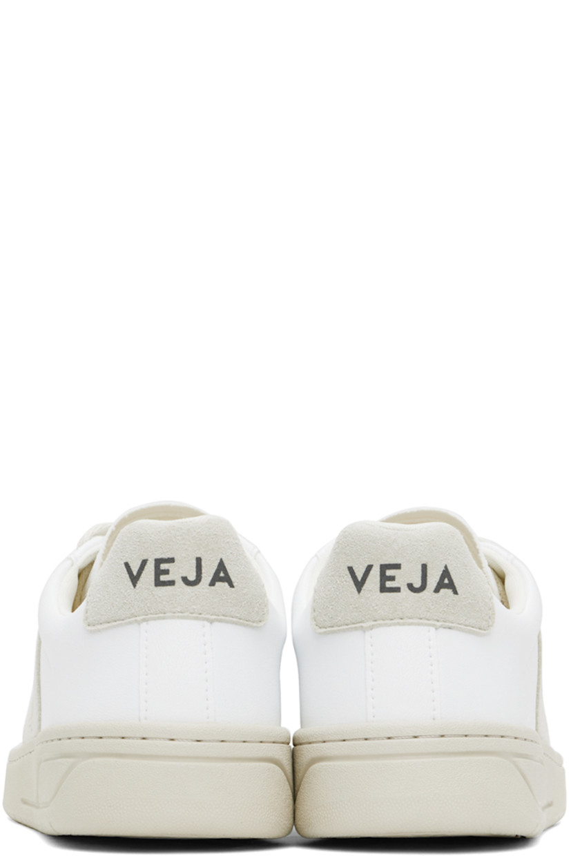 Low-top grained C.W.L. faux-leather and faux-suede sneakers in white.

· Lace-up closure
· Logo printed at padded tongue
· Padded collar 
· Logo appliqué at sides
· Logo printed at heel tab
· Mesh lining
· Treaded rubber sole

Supplier color: White/Natural