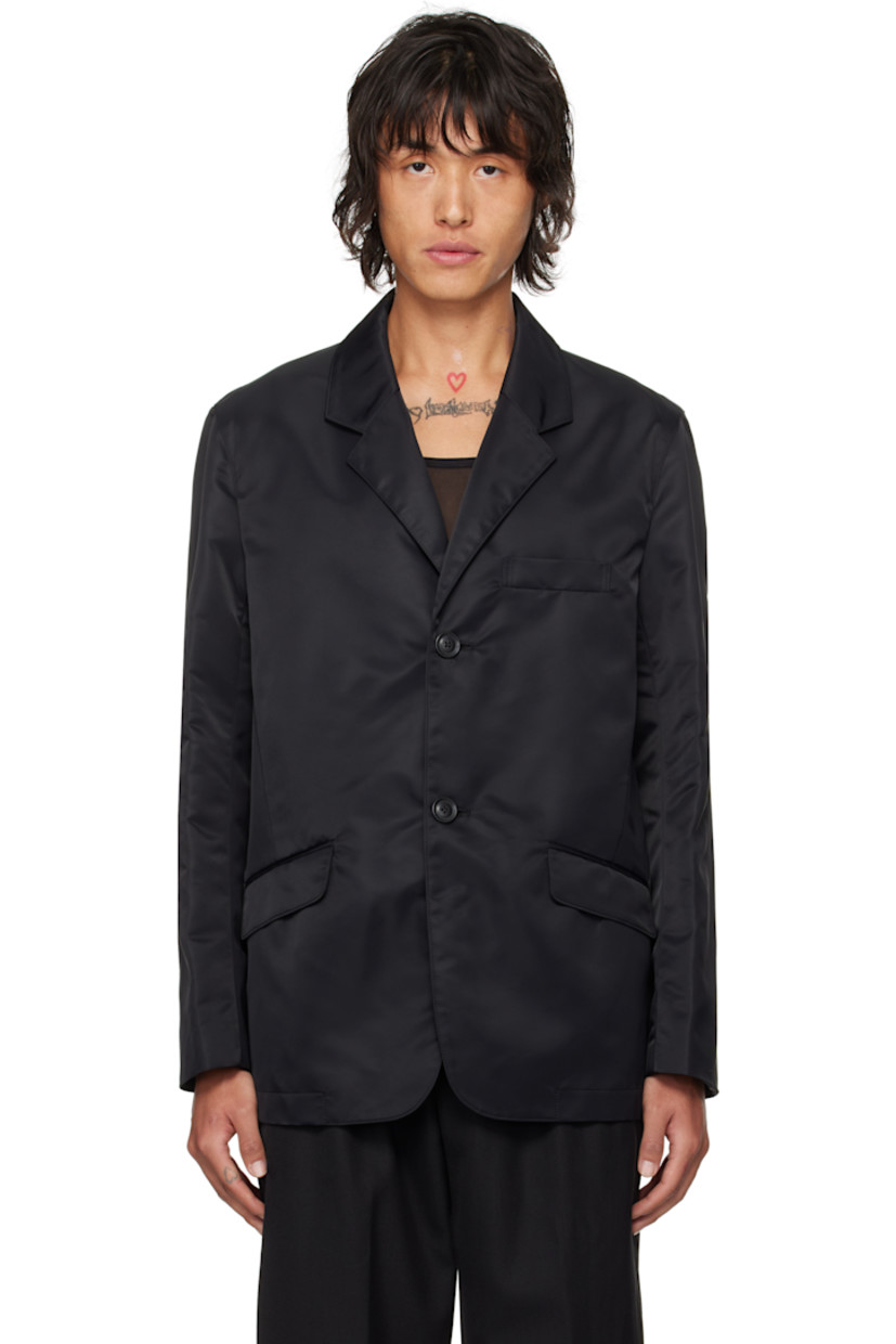 GRS-certified recycled nylon taffeta blazer.

· Notched lapel
· Single-breasted button closure
· Flap pockets
· Darts at front waist 
· Welt pockets at interior
· Full viscose satin lining

Supplier color: Black