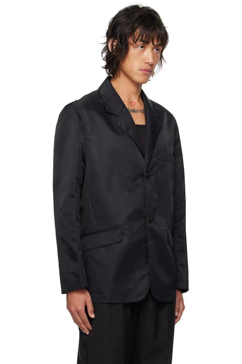 GRS-certified recycled nylon taffeta blazer.

· Notched lapel
· Single-breasted button closure
· Flap pockets
· Darts at front waist 
· Welt pockets at interior
· Full viscose satin lining

Supplier color: Black