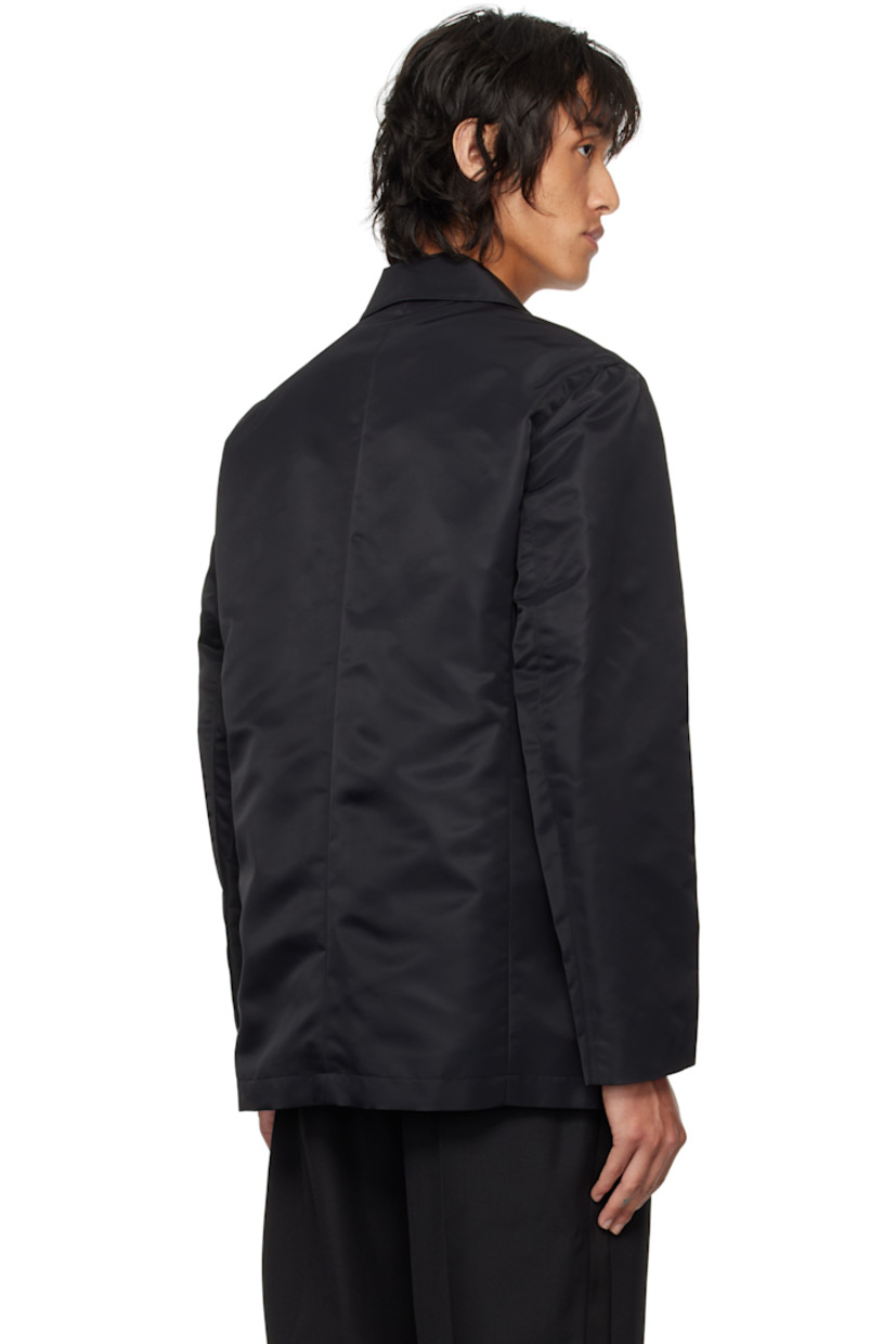 GRS-certified recycled nylon taffeta blazer.

· Notched lapel
· Single-breasted button closure
· Flap pockets
· Darts at front waist 
· Welt pockets at interior
· Full viscose satin lining

Supplier color: Black