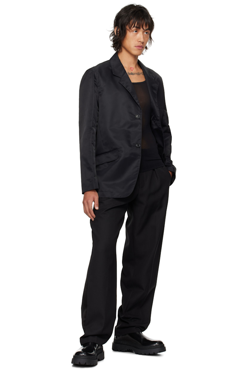 GRS-certified recycled nylon taffeta blazer.

· Notched lapel
· Single-breasted button closure
· Flap pockets
· Darts at front waist 
· Welt pockets at interior
· Full viscose satin lining

Supplier color: Black
