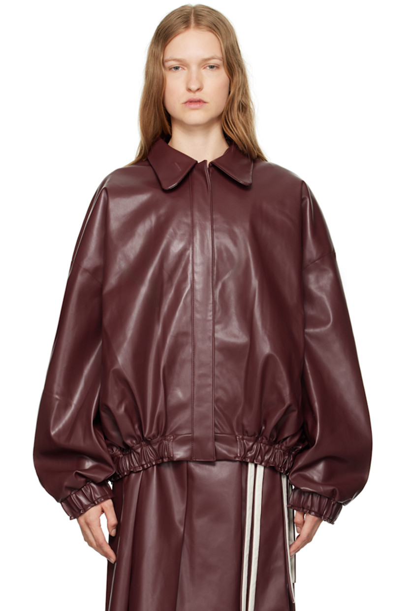 Grained faux-leather jacket. 

· Peter Pan collar
· Buttonhole at collar
· Zip closure
· Welt pockets
· Elasticized hem and cuffs
· Full plain-woven lining

Supplier color: Red leather