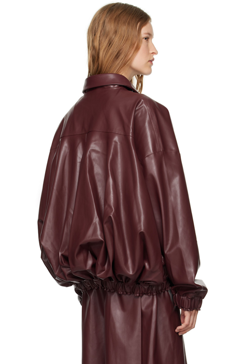 Grained faux-leather jacket. 

· Peter Pan collar
· Buttonhole at collar
· Zip closure
· Welt pockets
· Elasticized hem and cuffs
· Full plain-woven lining

Supplier color: Red leather