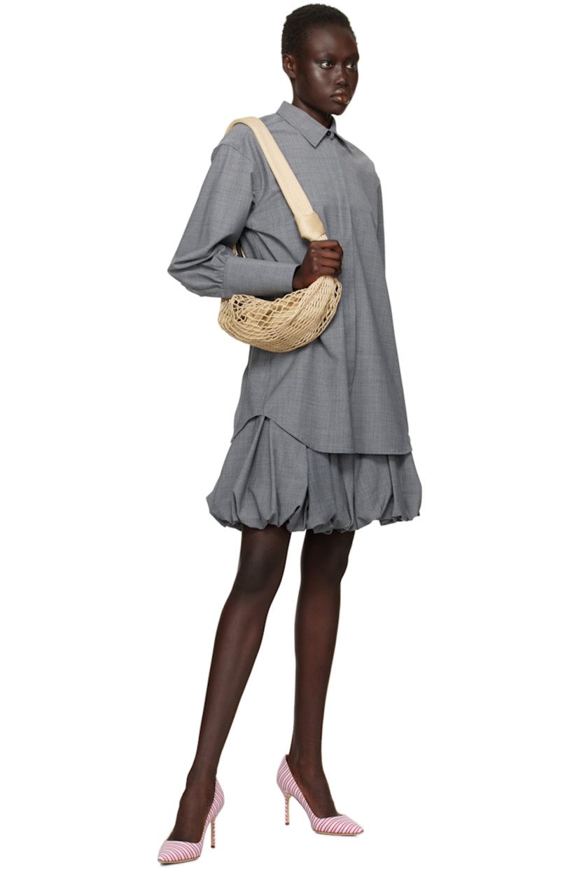 Plain-woven polyester shirt.

· Spread collar
· Button closure
· Balloon sleeves
· Three-button barrel cuffs
· Inverted box pleat at back yoke
· Cutout at back

Supplier color: Grey tailoring