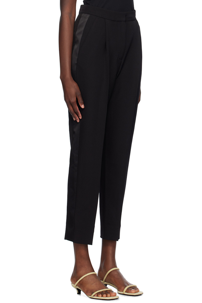 Tapered virgin wool grain de poudre trousers.

· Four-pocket styling
· Zip-fly
· Pleats at front
· Satin trim at outseams 
· Creased legs

Supplier color: Black