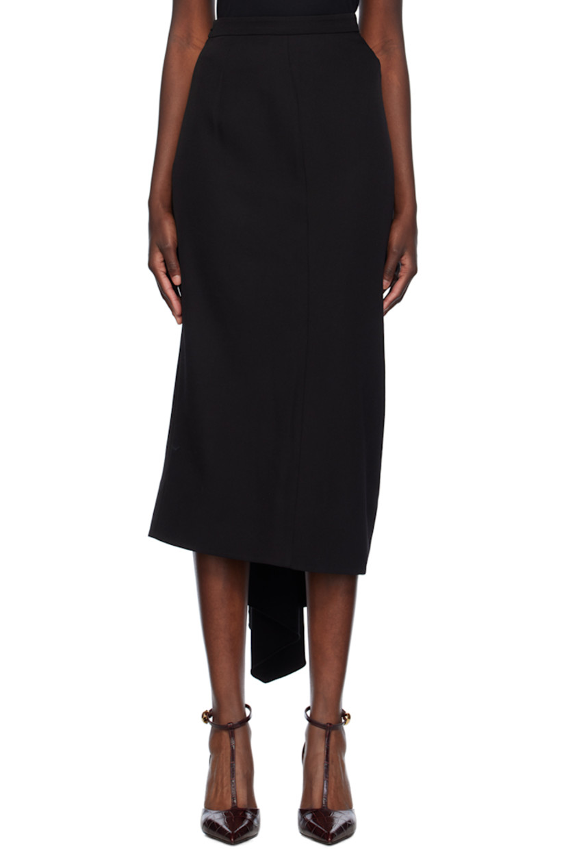 Virgin wool grain de poudre skirt. 

· Draping at front and side
· Extended trim at side seam
· Slit at side seam
· Concealed zip closure at back
· Full silk crepe de chine lining 

Supplier color: Black