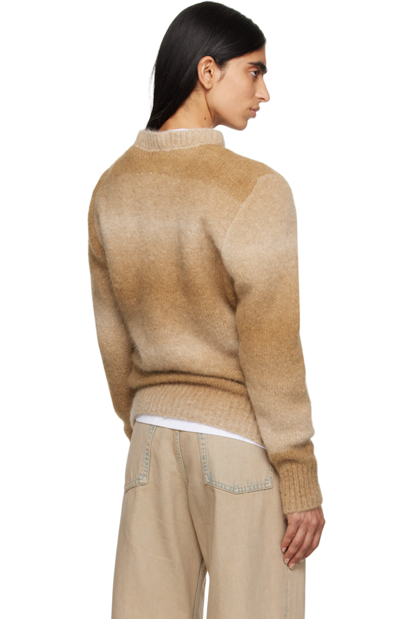 Knit alpaca-blend sweater. Gradient throughout.

· Rib-knit crewneck, hem, and cuffs
· Dropped shoulders
· Logo embroidered at sleeve

Supplier color: Tan