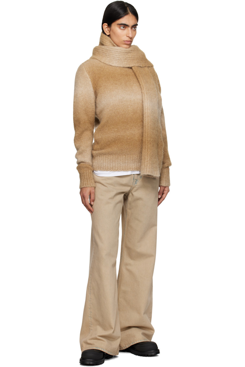 Knit alpaca-blend sweater. Gradient throughout.

· Rib-knit crewneck, hem, and cuffs
· Dropped shoulders
· Logo embroidered at sleeve

Supplier color: Tan