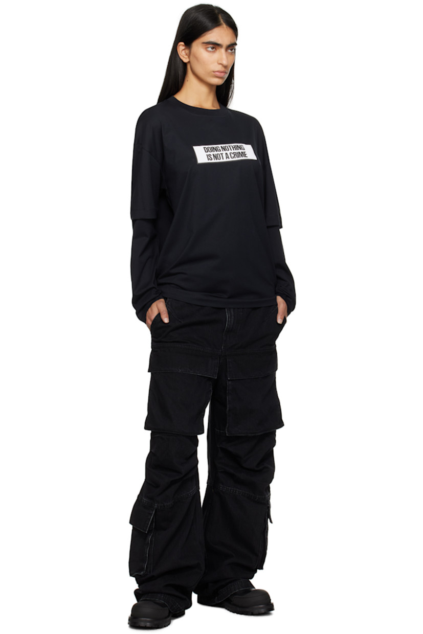 Organic cotton jersey T-shirt.

· Layered construction
· Rib-knit crewneck
· Text printed at chest
· Logo embroidered at hem 
· Dropped shoulders

Supplier color: Black