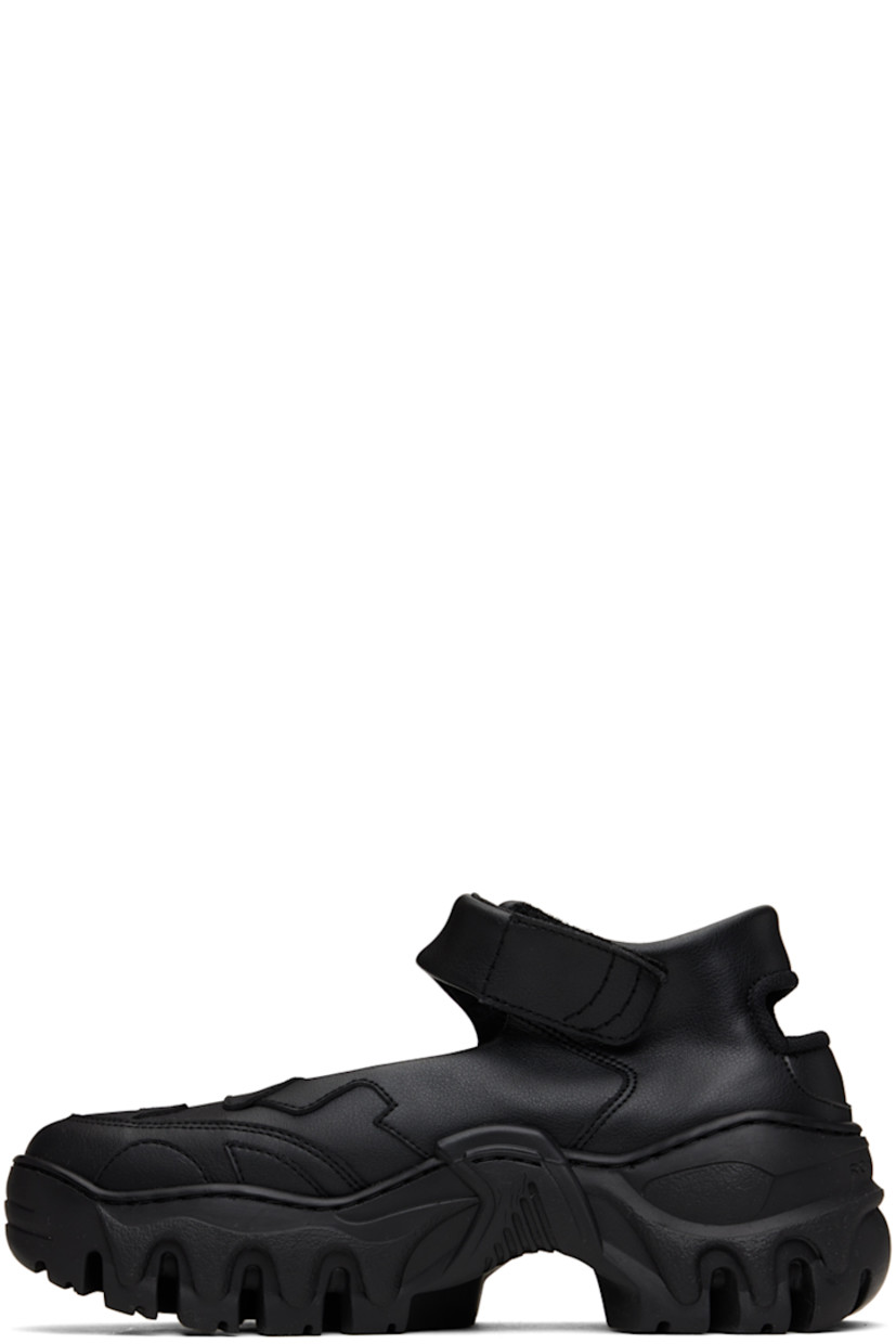 Handcrafted low-top Bureau Veritas-certified grained faux-leather Mary Jane-style sneakers in black.

· Velcro ankle strap
· Cutout at outer side and heel counter
· Mesh and buffed faux-leather lining
· Logo embossed at heel
· Treaded TPU sole

Supplier color: Black beyond leather