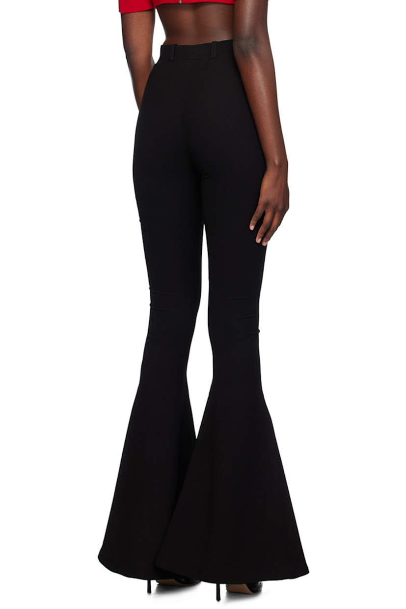 Flared polyester crepe trousers. Twisted seams throughout.

· Belt loops
· Zip-fly
· Vented cuffs

Supplier color: Black
