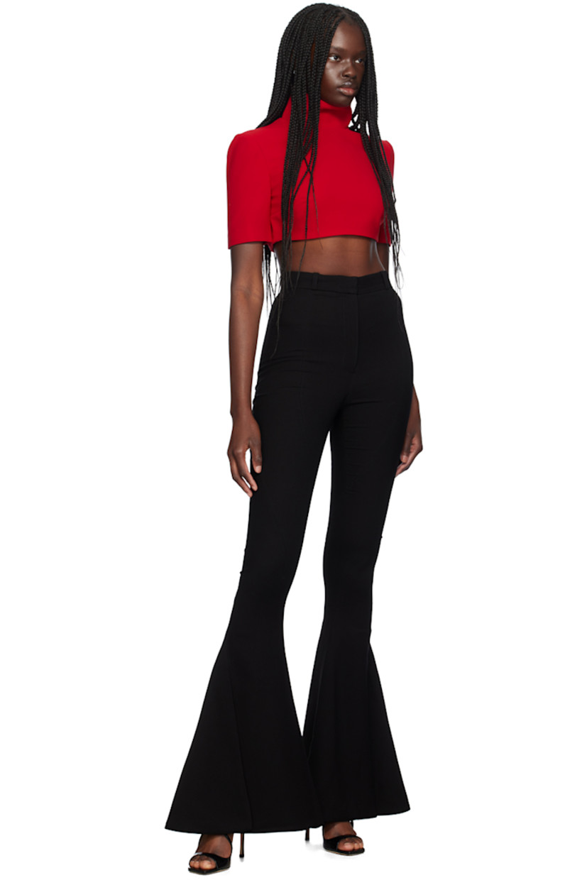 Flared polyester crepe trousers. Twisted seams throughout.

· Belt loops
· Zip-fly
· Vented cuffs

Supplier color: Black