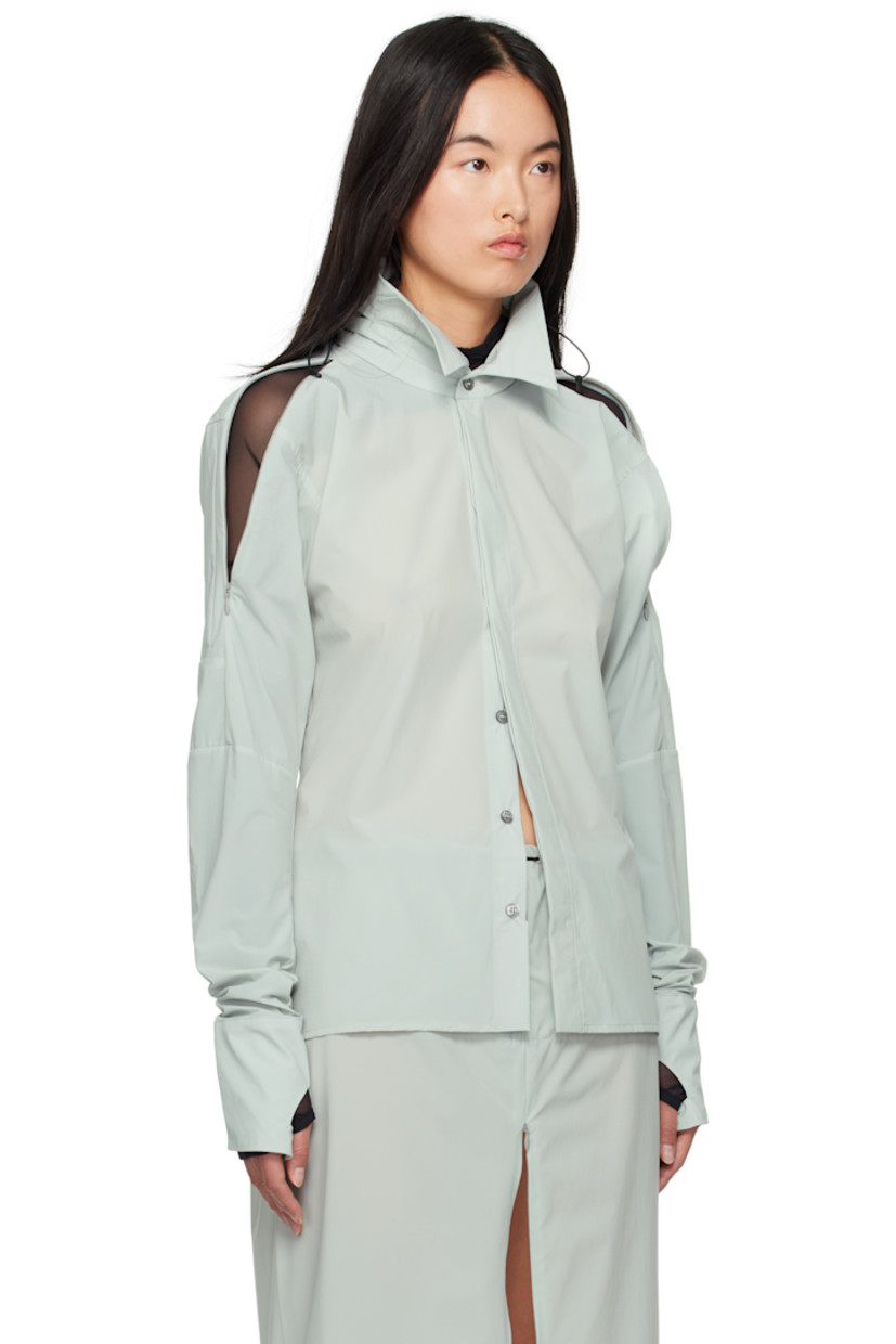 Stretch recycled nylon taffeta shirt.

· Bungee-style drawstring at stowaway hood
· Spread collar
· Button closure
· Shirttail hem
· Zip vent at shoulders
· Thumbhole at cuffs
· Zip vent at back yoke

Supplier color: Mint