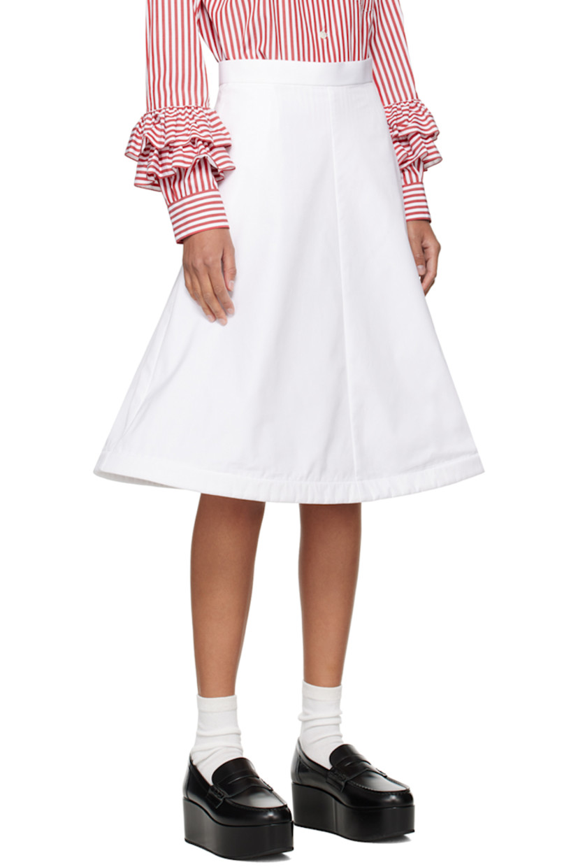 Cotton broadcloth skirt. 

· Single-pocket styling
· Concealed wire at structured flared hem
· Concealed zip closure at side 

Supplier color: White