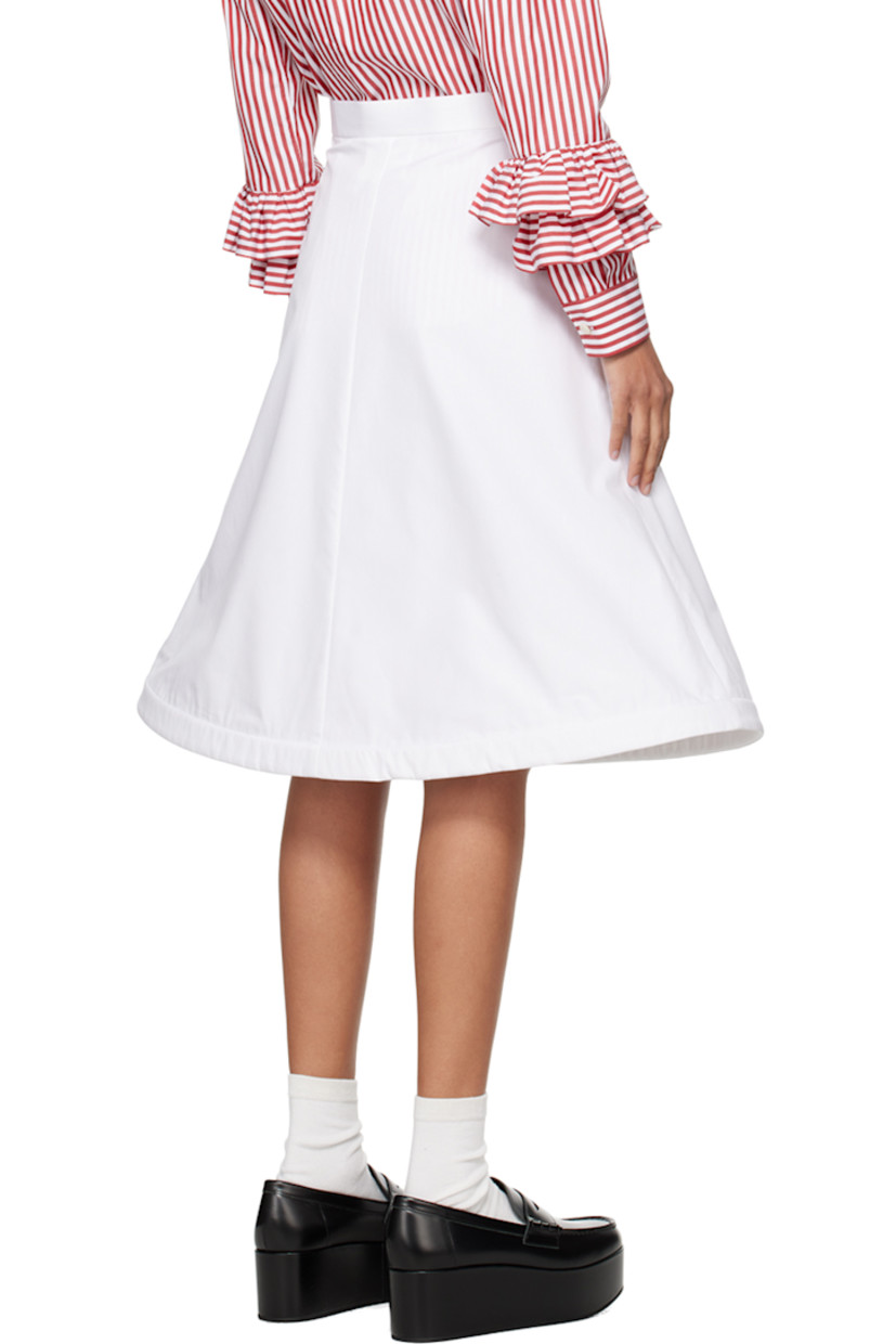 Cotton broadcloth skirt. 

· Single-pocket styling
· Concealed wire at structured flared hem
· Concealed zip closure at side 

Supplier color: White
