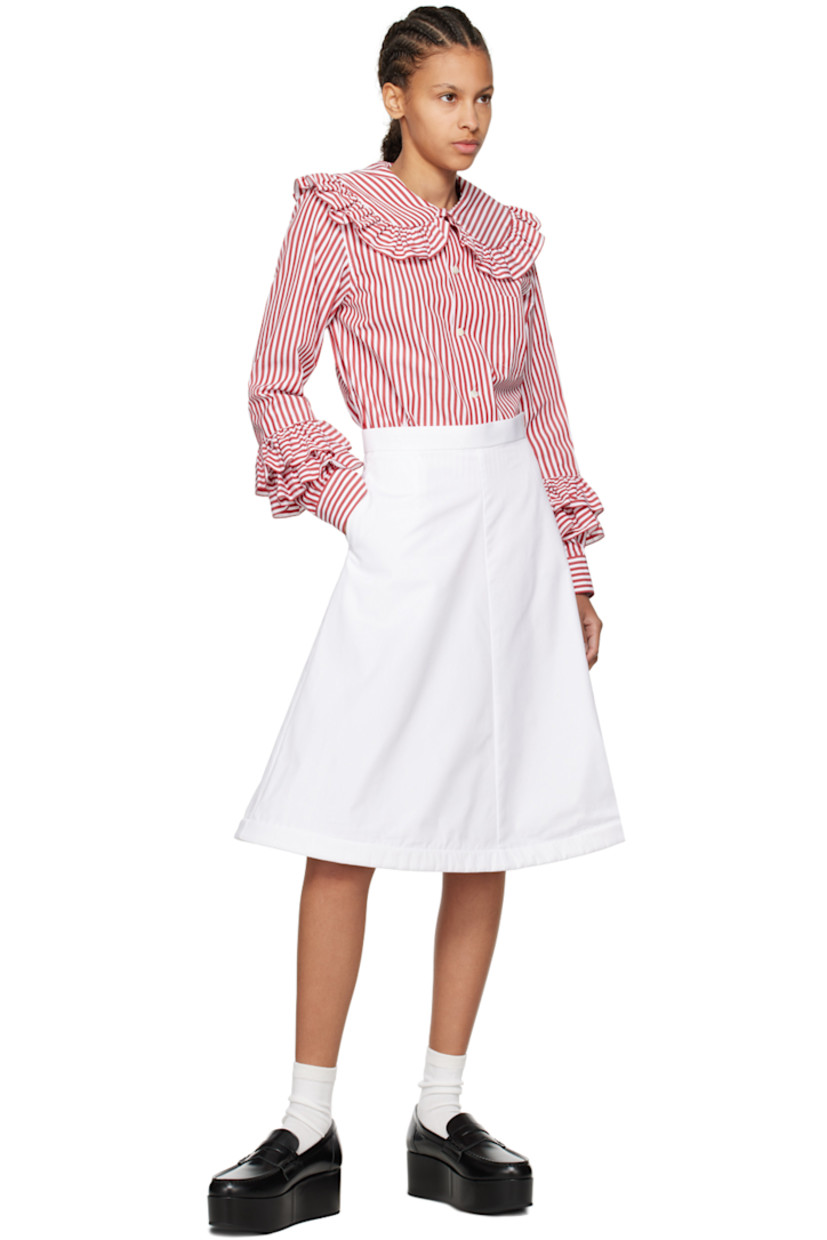 Cotton broadcloth skirt. 

· Single-pocket styling
· Concealed wire at structured flared hem
· Concealed zip closure at side 

Supplier color: White