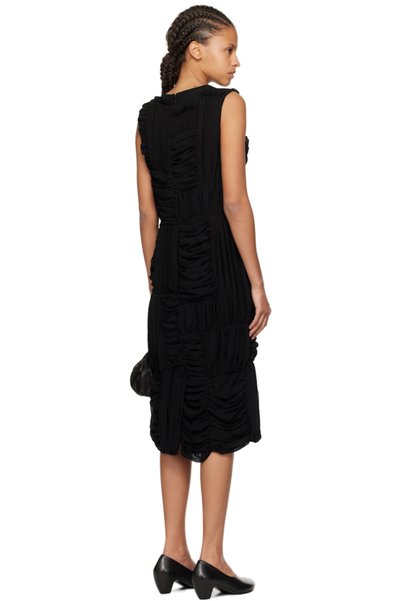 Polyester georgette dress. Ruching throughout.

· Paneled construction
· Round neck
· Ruffles at front and back
· Seam pockets
· Concealed zip closure at back
· Central vent at back hem
· Fully lined

Supplier color: Black
